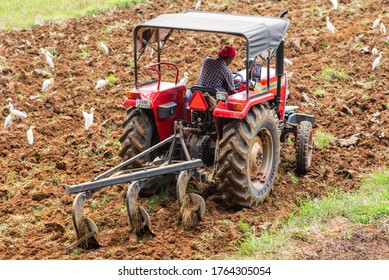 Curtorim, Goa/India- May 22 2020:  Tractor And Tiller, Plower Used In Agriculture Machinery Used In The Field For Paddy Cultivation/Agricultural Scene In Goa,India