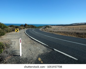 Curve On A Wide Open Country Road Leading To The Pacific Ocean