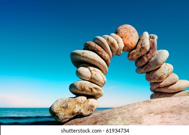 Curve of the pebbles on the sea coast - Shutterstock ID 61934734