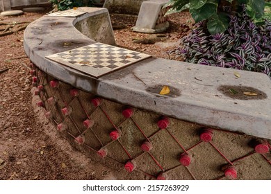 A Curved Bench, Made With Concrete And Recycled Plastic Bottles.