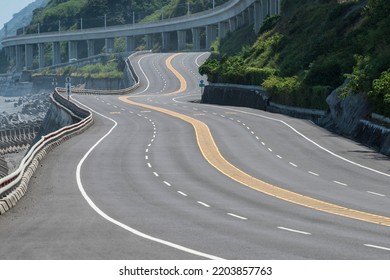 Curved Coast Highway Beside The Elevated Railway