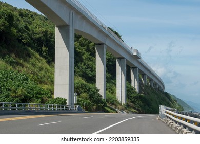 Curved Coast Highway Under The Elevated Railway