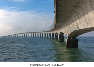 Curved Concrete Bridge Over The Water. Horizontal Shot