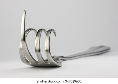 Curved Fork With Raised Middle Finger
