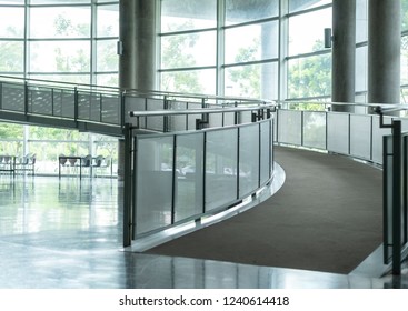 Curved Hallway In Building. Indoor Walkway  Interior In Modern Office Corridor. Architecture Way For Universal Design.