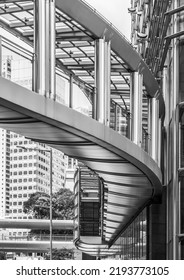 A Curved Metal And Glass Walkway In Hong Kong.