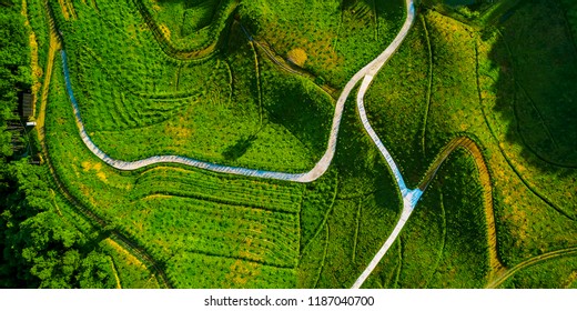 Curved path between mountains