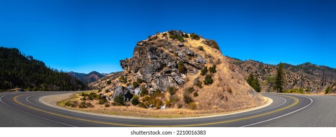 Curved Paved Mountain Road With Rocky Hill Along Trinity River On State Route 299 Near Del Loma, Northern California