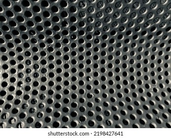 Curved Perforated Metal Sheet Close Up Black And White