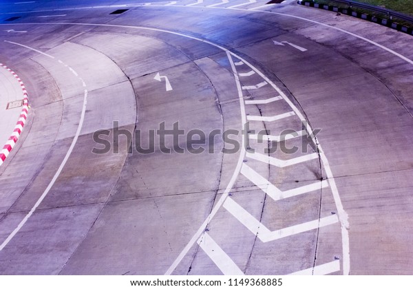 Curved road with road
marking and arrow