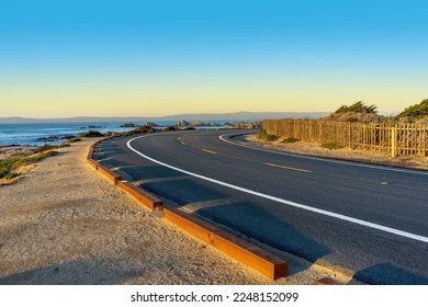 Curved road with an ocean view in the Monterey Bay town of Pacific Grove - Powered by Shutterstock