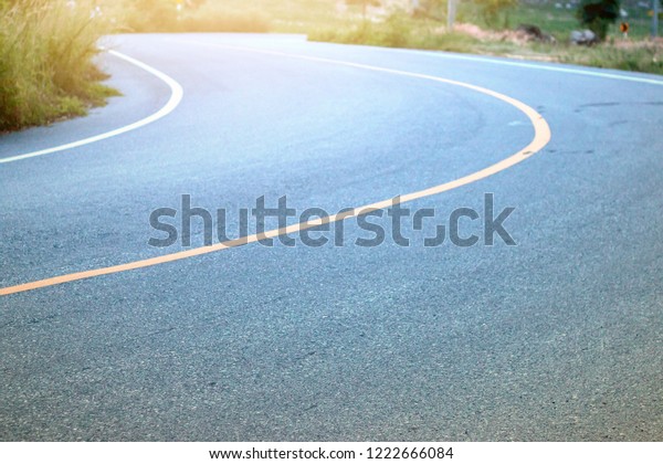 Curved road on the asphalt\
road.