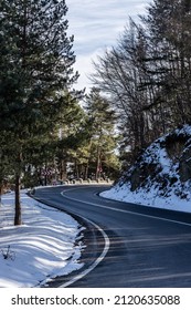 Curved Road Through Snowy Landscape. Road From Brasov To Poiana Brasov In Romania