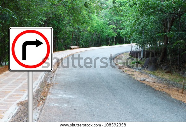Curved Road Traffic Sign on\
a a road