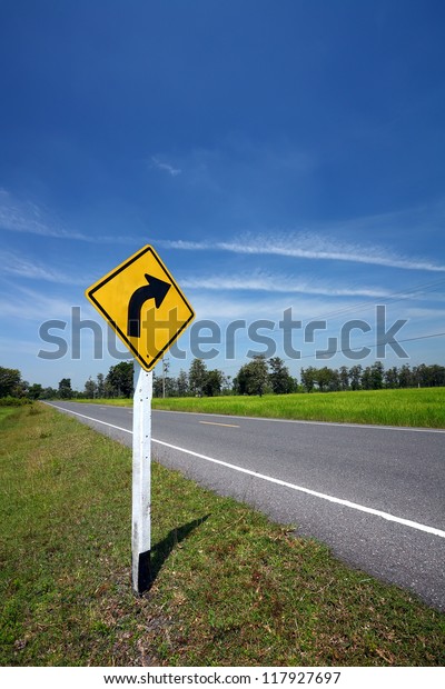 Curved Road Traffic Sign on
a a road
