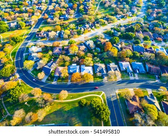 Curved Streets Over Community Homes New Development outside of Austin , Texas near Round Rock Green Grass Colorful Autumn Fall Colors Modern Houses 