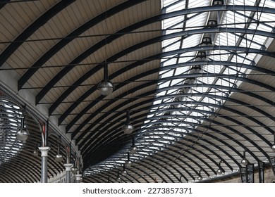 Curves and arcs of vintage Victorian steel and glass roof of Newcastle Central Station in North East England - Shutterstock ID 2273857371
