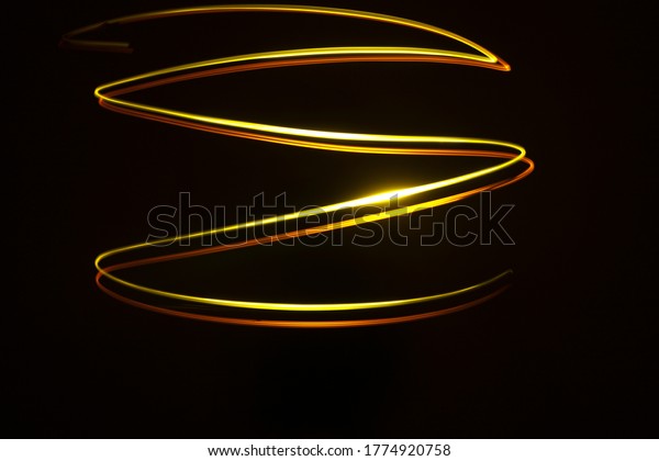 curves and infinity waves of neon light
against a black
background