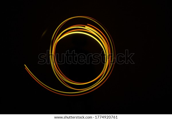 curves and infinity waves of neon light
against a black
background
