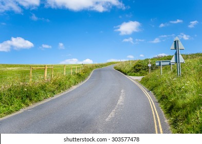 Curving Country Road In Cornwall On Clear Spring Day