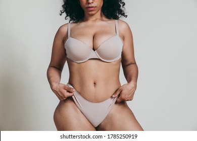 Curvy girl posing in studio. Concept about body positivity