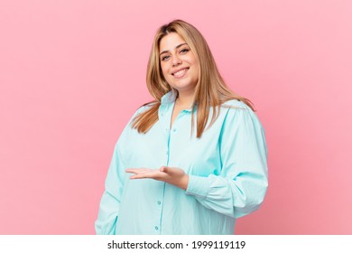 Curvy Pretty Blonde Woman Smiling Cheerfully, Feeling Happy And Showing A Concept