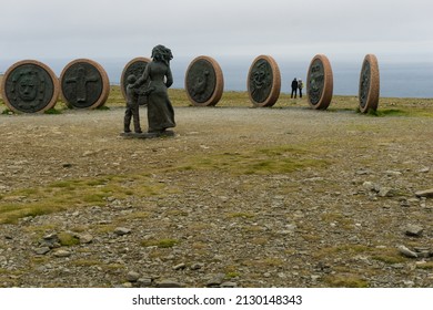 CUSAGO, ITALY - Aug 08, 2019: A rear view of mother and daughter sculpture in Nordkapp, Norway