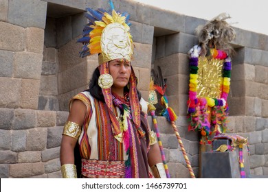 Cusco, Peru - Apr 6, 2017: Native Indian Quechua Man Dressed As Incan Healer Shaman Performing Traditional Ritual, Stone Temple Wall In The Background.