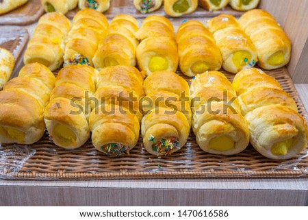 Custard bun roll with candy sprinkles for sale at patisserie