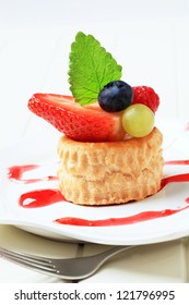 Custard Filled  Puff Pastry Shell Topped With Berry Fruit
