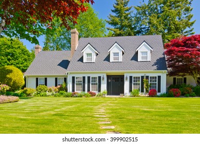 Custom built luxury house with nicely trimmed and landscaped front yard, lawn in a residential neighborhood. Vancouver Canada. - Shutterstock ID 399902515