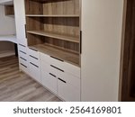 custom furniture production and customer wishes. laminate and chipboard. flooring made of wpc boards and vinyl. light beige tones. there are no cabinet doors yet