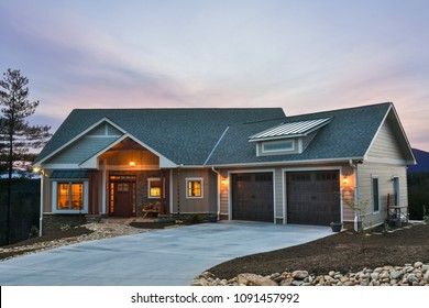 Custom Home Exterior With Front Porch During Sunset.