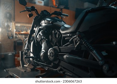 Custom motorcycle in authentic creative workshop with flare light visual effects