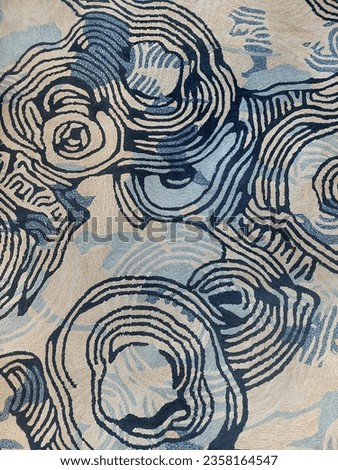 Custom random pattern carpet flooring. Carpet flooring is commonly found in luxurious hotel floor finishes. Shades of blue, light blue, and beige white color. Floral and swirl random pattern
