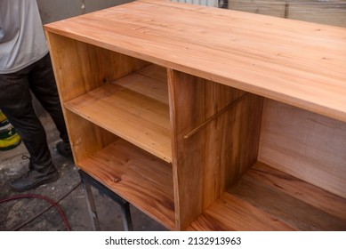 A Custom Shelf With A Thin Coat Of Varnish At A Woodworking Or Furniture Making Shop. Being Left To Dry.