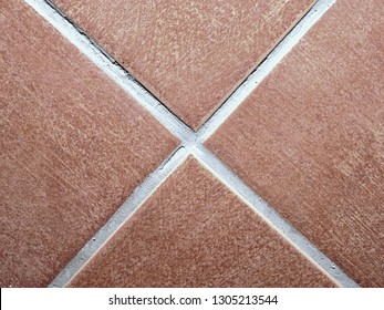 Custom Tile Bathroom Backsplash Wall With White  Chinks Between Tiles.