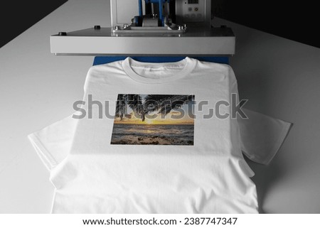 Custom t-shirt. Using heat press to print beautiful image of tropical seascape
