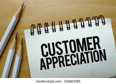 Customer Appreciation Text Written On A Notebook With Pencils