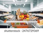 customer buying food groceries at the supermarket with shopping cart