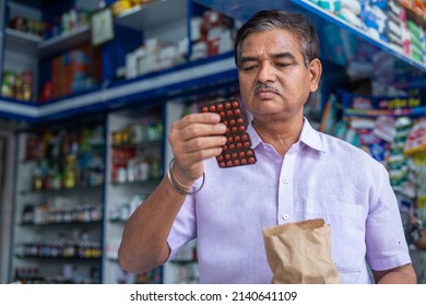 Customer Checking Medicine Price And Expiry Date At Retail Medical Shop After Purchasing - Concept Of Shopping, Consumer Awareness, Pharmacist And Health Care.