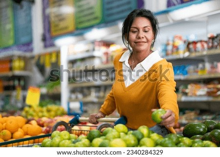 Customer chooses lemon in a neighborhood store