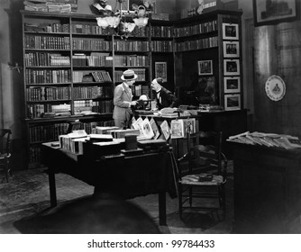 Customer And Clerk In Book Shop