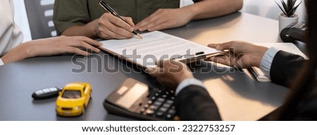 Customer client signs the contract with the agent or car dealer after successful car loan or purchasing a new car. Auto insurance and finance agreements. Prodigy