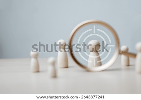 Customer data analytics. Behavior data analytics. Crm. Customer Behavior. A group of people are looking through a magnifying glass at a person. The people are all looking at the same person.