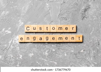 Customer Engagement Word Written On Wood Block. Customer Engagement Text On Cement Table For Your Desing, Concept.