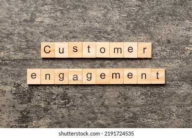 Customer Engagement Word Written On Wood Block. Customer Engagement Text On Cement Table For Your Desing, Concept.