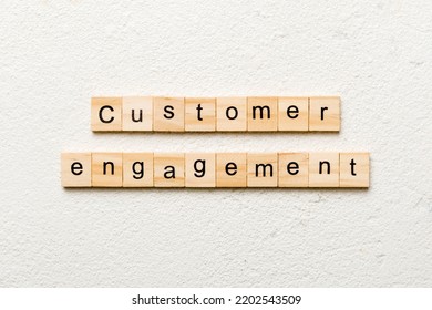 Customer Engagement Word Written On Wood Block. Customer Engagement Text On Cement Table For Your Desing, Concept.