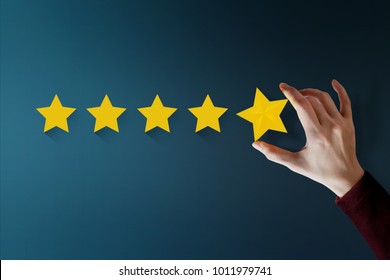 Customer Experience Concept, Best Excellent Services for Satisfaction present by Hand of Client giving a Five Star Rating
