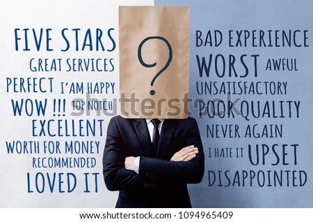 Customer Experience Concept, Businessman Client with Question Mark Icon on Paper Bag, Crossed arms and wearing Suit. Concrete Wall with Wording of Positive and Negative Reviews